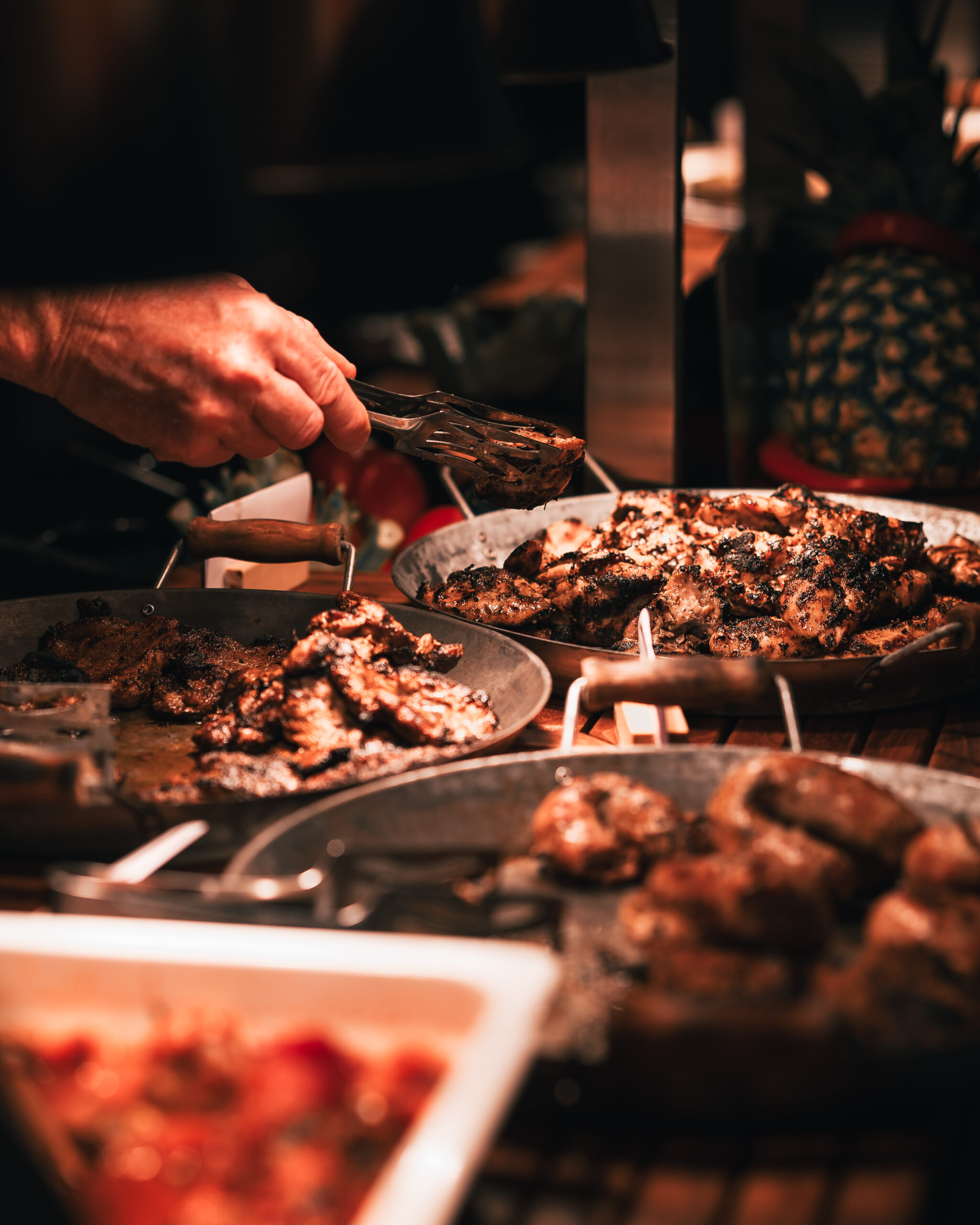 A selection of meats in skillets